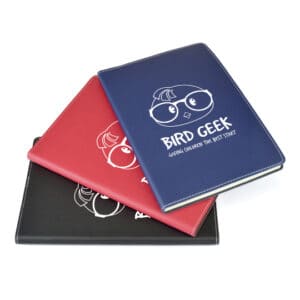 A5 stitch edge promotional notebooks in various colours with printed logo on a white background